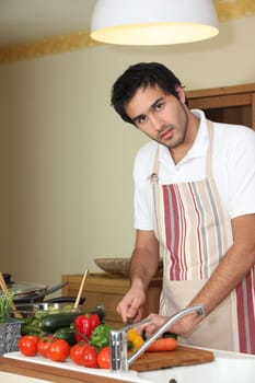 Young man preparing a healthy meal to eat
