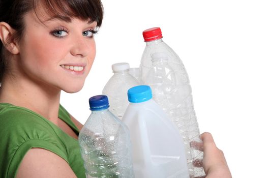 Young woman recycling plastic