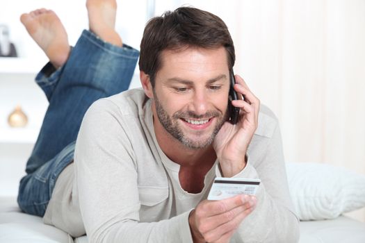 Man topping up phone
