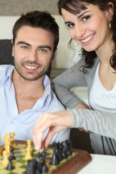 Young couple playing chess