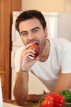 Man eating an apple
