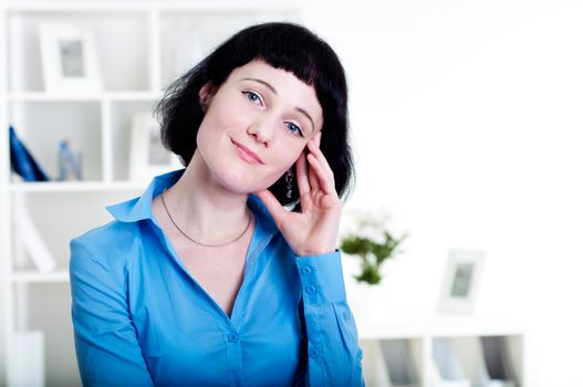 Portrait of a business woman in the office doing some paperwork