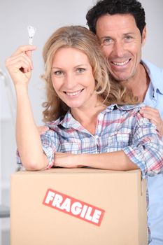 Couple with the key to their new home