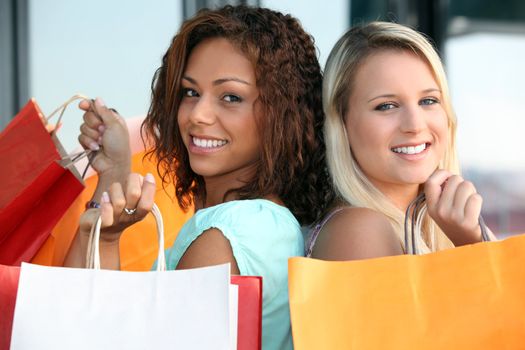 two girls doing shopping