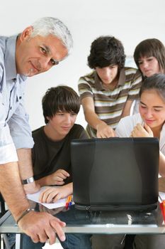 Teacher and pupils in classroom