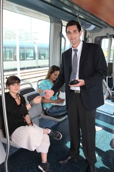 Man checking tram tickets