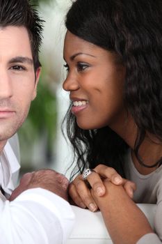 mixed couple looking happy