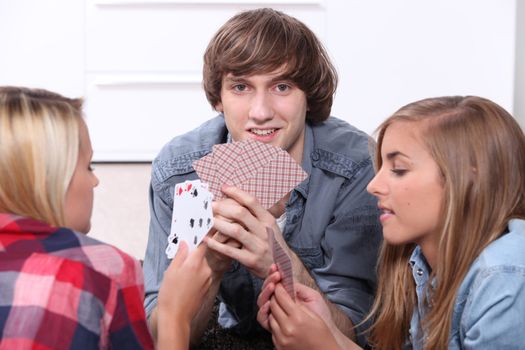 Teenagers playing cards
