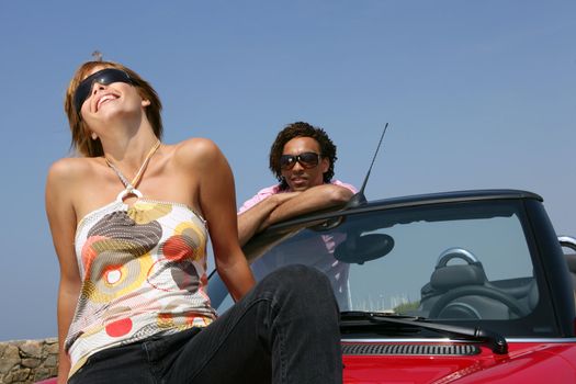 Couple with convertible car