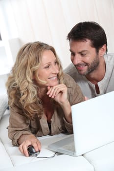 Couple using a laptop