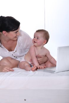 Mother and baby daughter at home