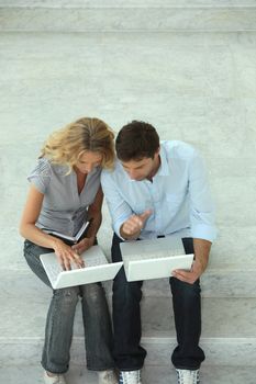 Couple with two computers