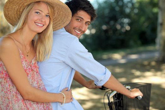 A young couple on a bike ride.