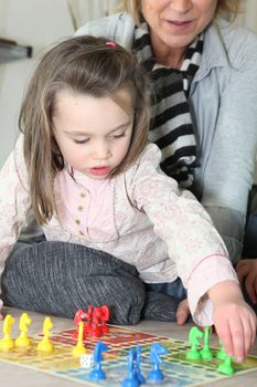 Little girl playing with grandma