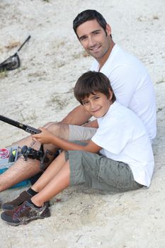 father and son at fishing party