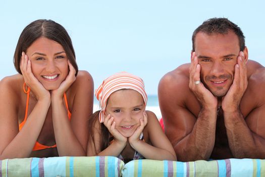 Portrait of a lovely family at the beach