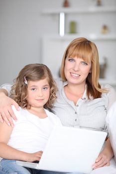 Woman helping her daughter with her homework