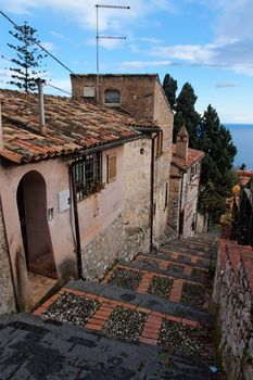 Small street in Sicilian town of Taormina descending toward the sea