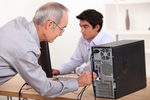 Man wiring computer