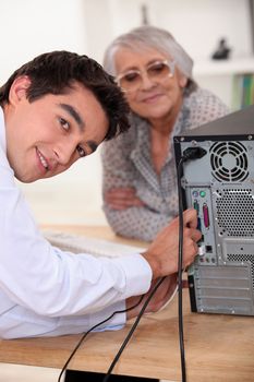 young man repairing a computer