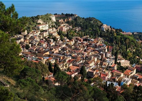 View ofTaormina town with Roman theater and sea  from Monte Tauro  in Sicily,Italy