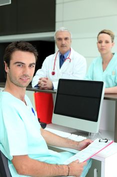 Doctors gathered around reception