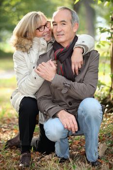Mature couple walking in the woods