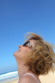 Closeup of woman's head with beach background