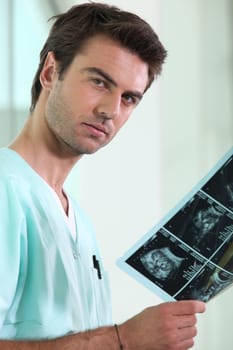 Male doctor with x-ray image