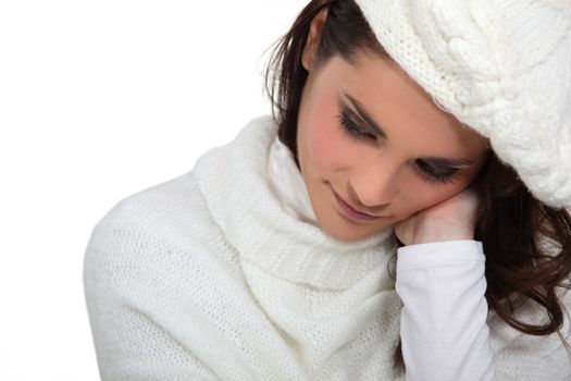 Shy woman wearing hat and jumper