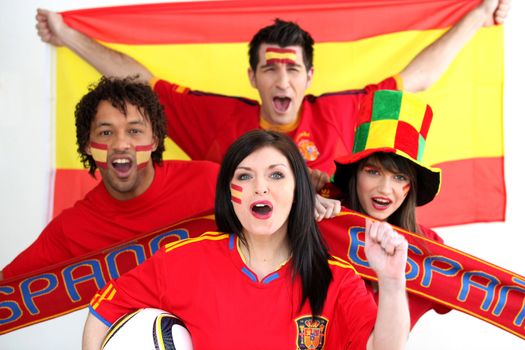 A group of people show their support of the Spanish football team