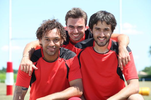 Three friendly young rugby players