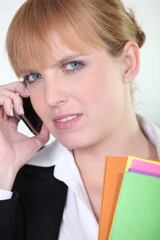 Office worker using a mobile phone