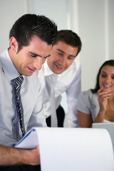 Happy business colleagues in meeting