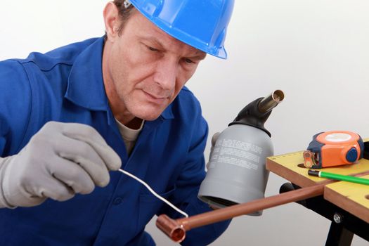 craftsman working with a welding torch