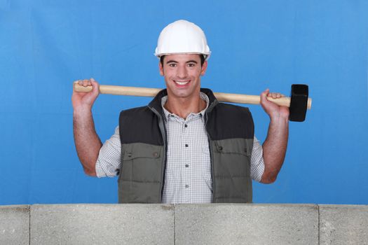 Builder with a sledgehammer