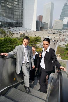 Business people on an escalator