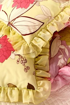 fragment of an interior of a bedroom. a heap of pillows on a bed
, close up, double 3