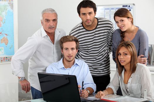 Young team working at a laptop