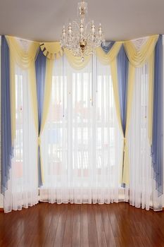 the windows decorated with curtains with a machine embroidery, double 10