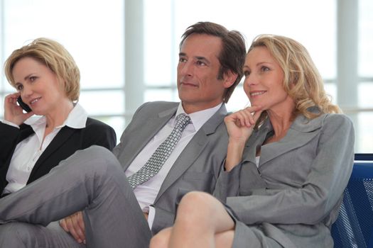 Businesspeople waiting in an airport hall