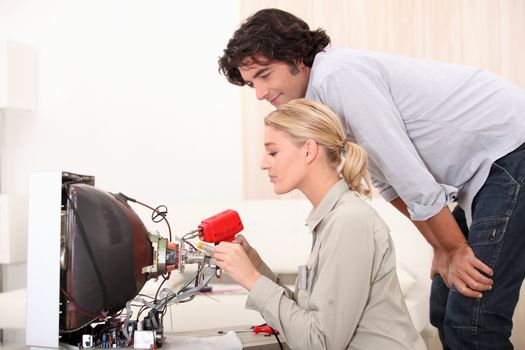 female technician doing repairs