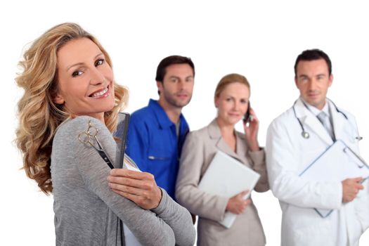 Hairdresser with comb and scissors, mechanic, doctor and secretary a�� close-up.