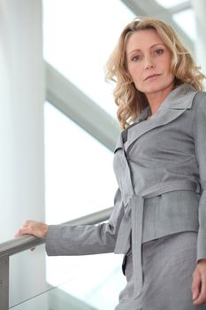 Businesswoman walking down steps
