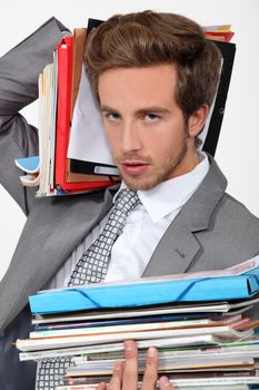 Man overwhelmed by files