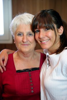 Portrait of a senior woman and a smiling young woman