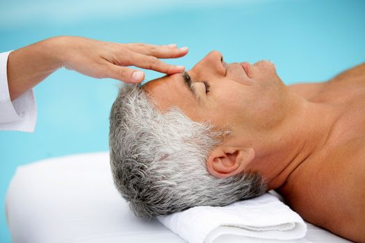Mature man having facial massage