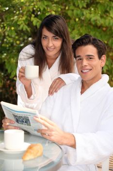 young couple on vacation having breakfast