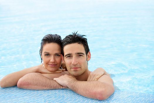 Portrait of a couple at a poolside