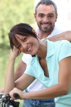Couple taking a bike ride through the countryside